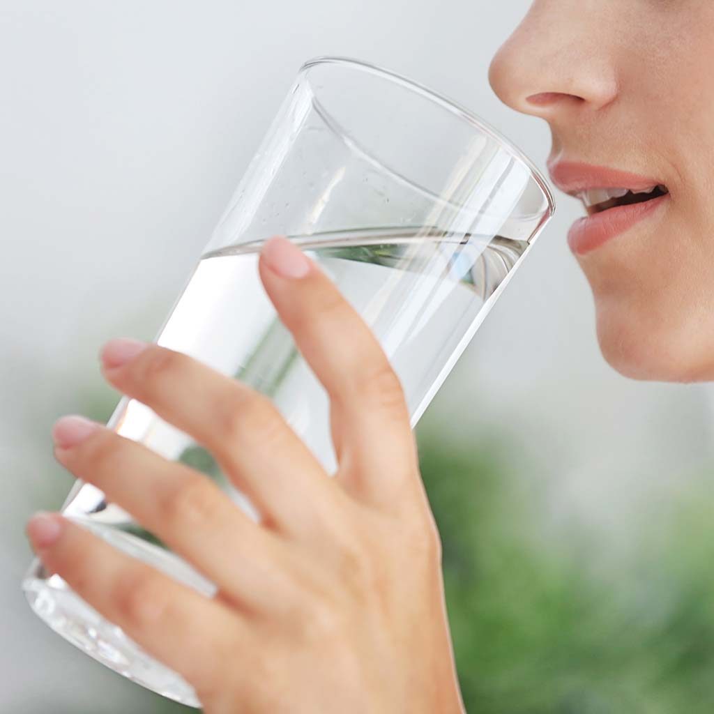 Woman Drinking Water From A Glass