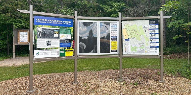 Central Ganaraska Forest Trailhead sign, including 3 panels of educational information, a bulletin board and a map